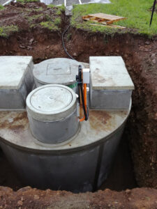 Aerogreen wastewater treatment system placed in excavation before backfilling