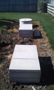 Septech 2000 wastewater treatment unit installed neatly at a residential property